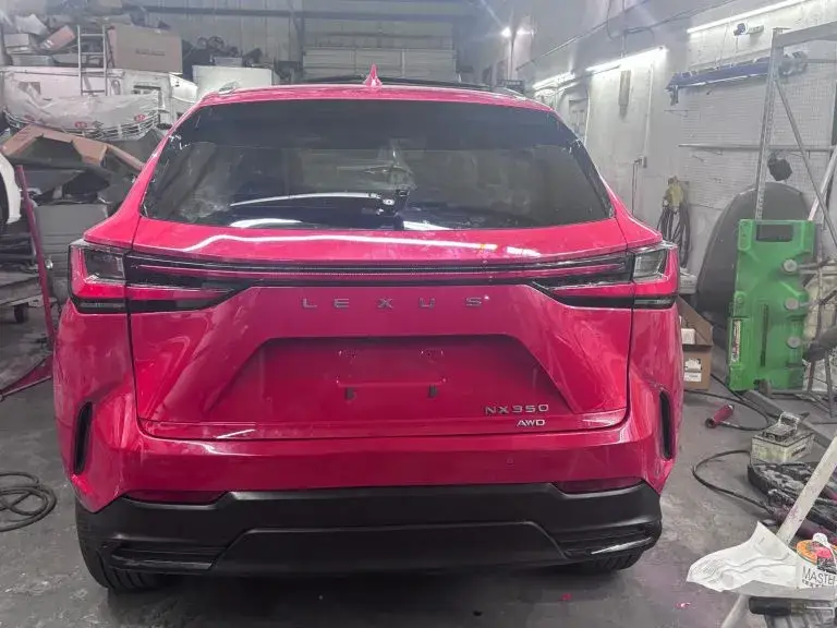 Red Lexus NX350 after rear-end damage before collision repair