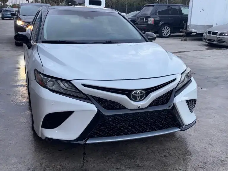 White Toyota Camry after front-end collision repair