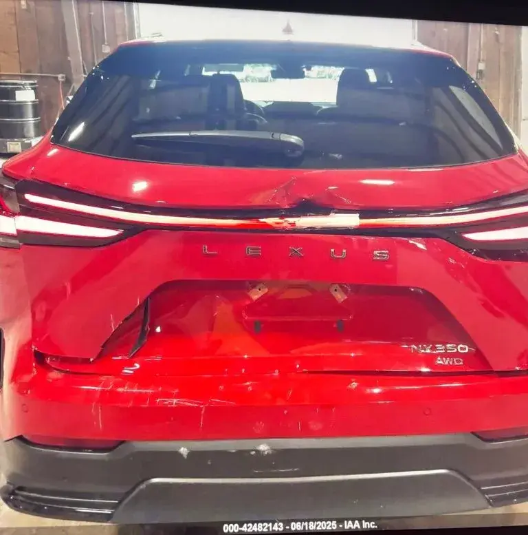Red Lexus NX350 with rear-end damage before collision repair