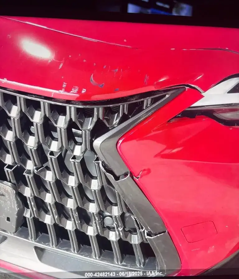 Red Lexus with front-end damage before repair